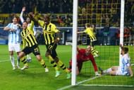 Felipe Santana (C) of Borussia Dortmund celebrates scoring their third and winning goal with team mate Julian Schieber as goalkeeper Willy Caballero and Martin Demichelis (L) of Malaga react during the UEFA Champions League Quarter Final second leg match between Borussia Dortmund and Malaga at Signal Iduna Park on April 9, 2013 in Dortmund, Germany. (Photo by Alex Grimm/Bongarts/Getty Images)
